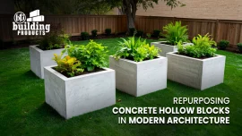 Cool-toned concrete hollow blocks repurposed as minimalist planters on a green lawn, showcasing sustainable modern architecture.